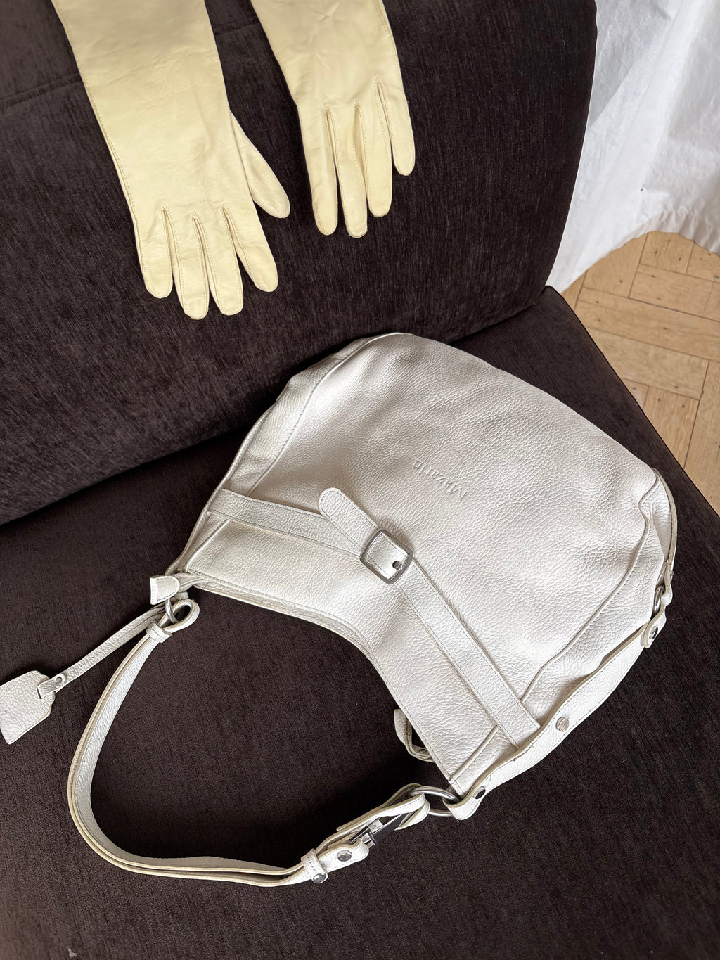 White leather buckle bag